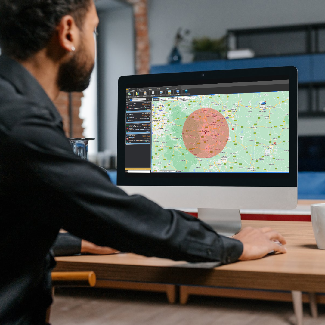 A man using a computer to set up geofencing