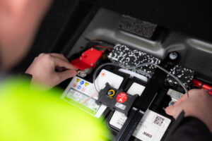A trackit247 dealer installs a tracker into a customer's vehicle