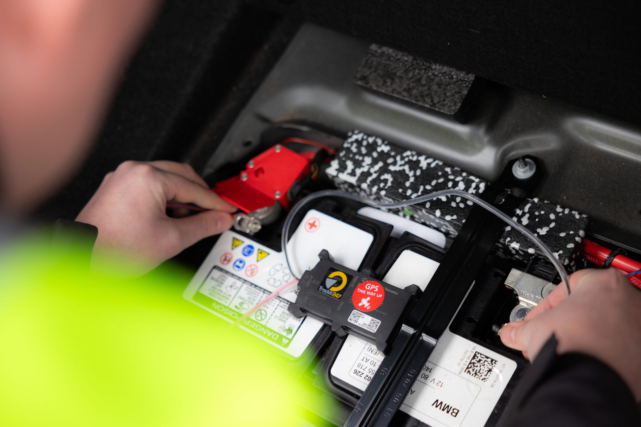 A trackit247 dealer installs a tracker into a customer's vehicle